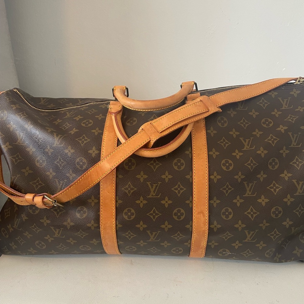 Louis Vuitton Brown Travel Bag with Monogram Design and Leather Accents